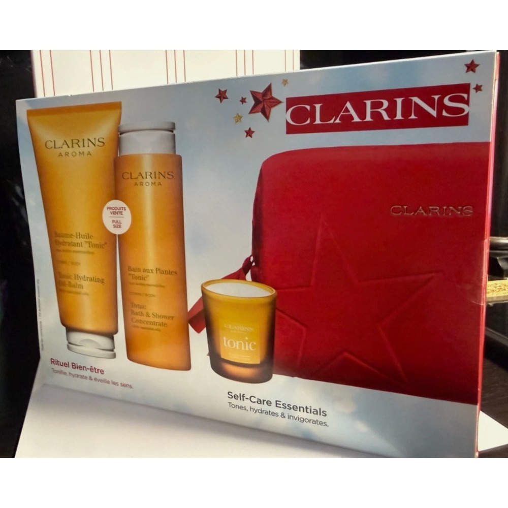 CLARINS‎ Aroma 4-PC set (Tonic Oil Balm, Bath & Shower Concentrate, Candle, Bag)